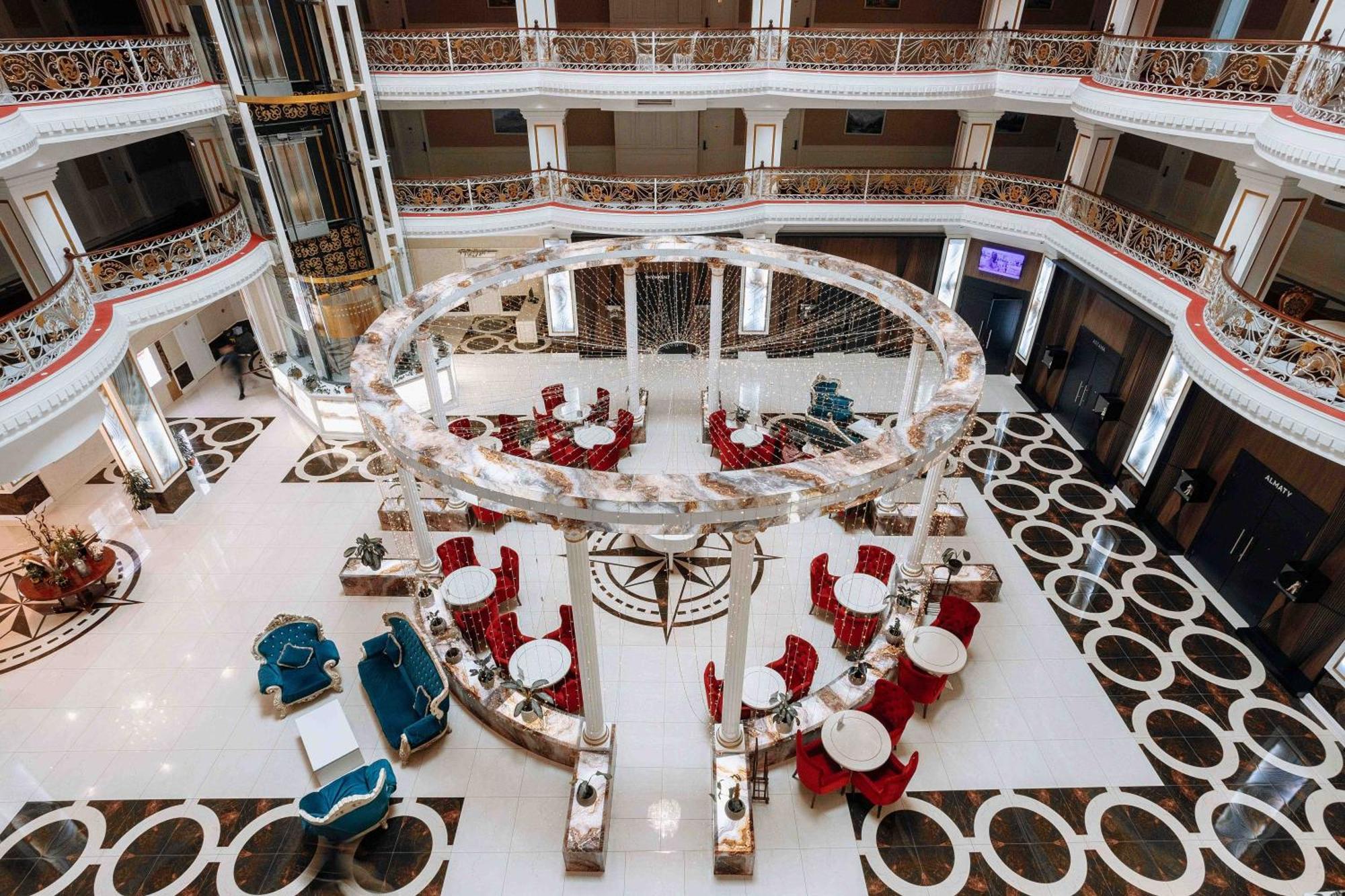 Hotel Ramada By Wyndham Shymkent Esterno foto