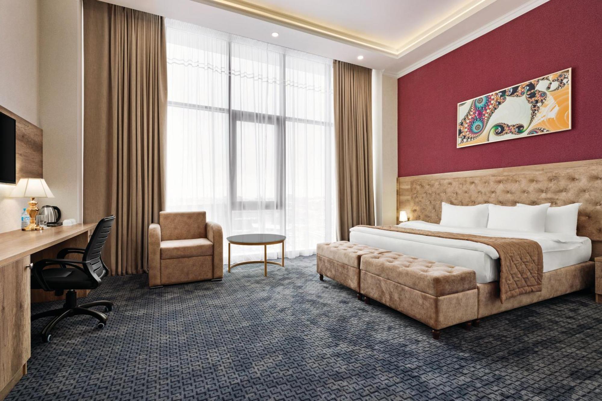 Hotel Ramada By Wyndham Shymkent Esterno foto