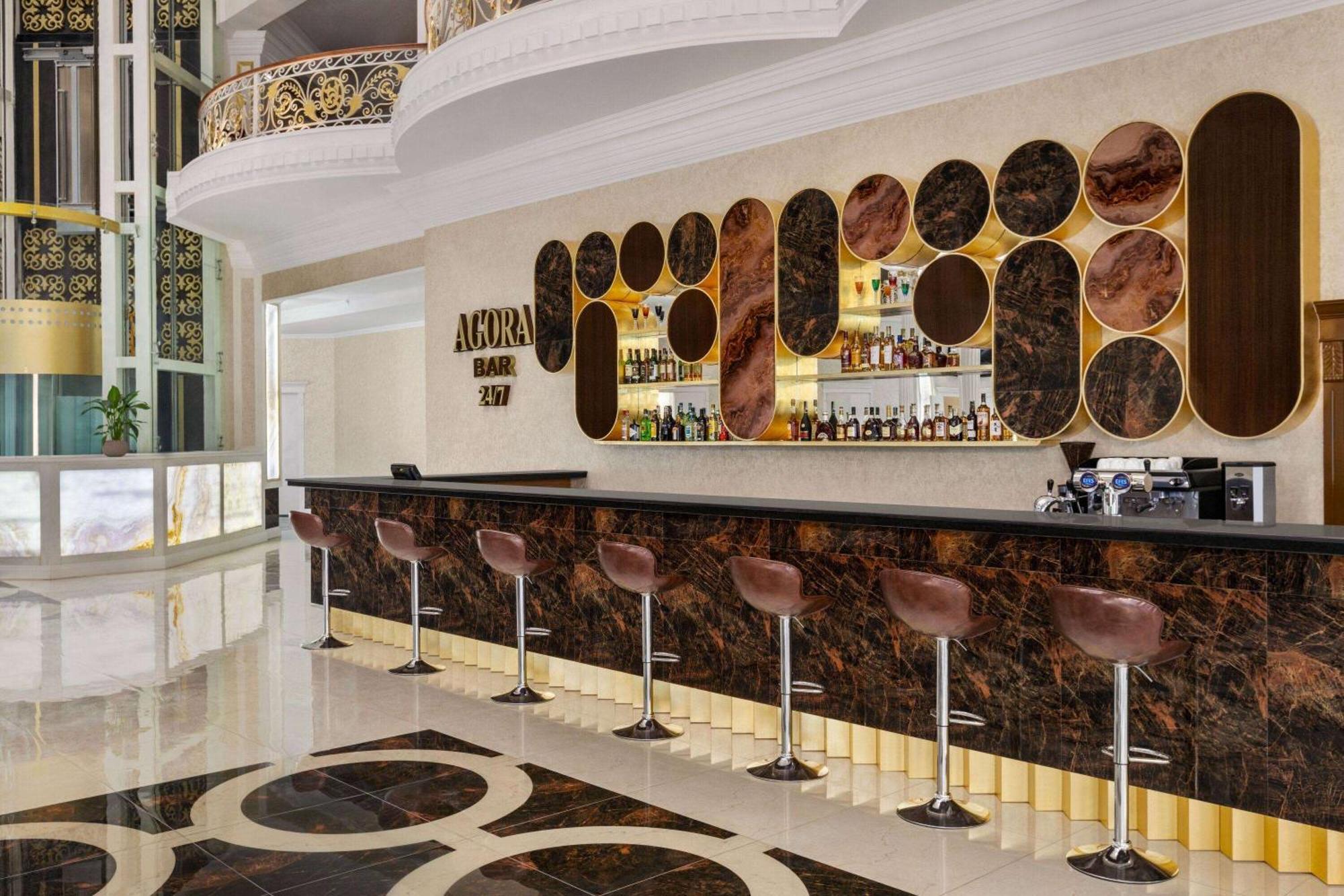Hotel Ramada By Wyndham Shymkent Esterno foto